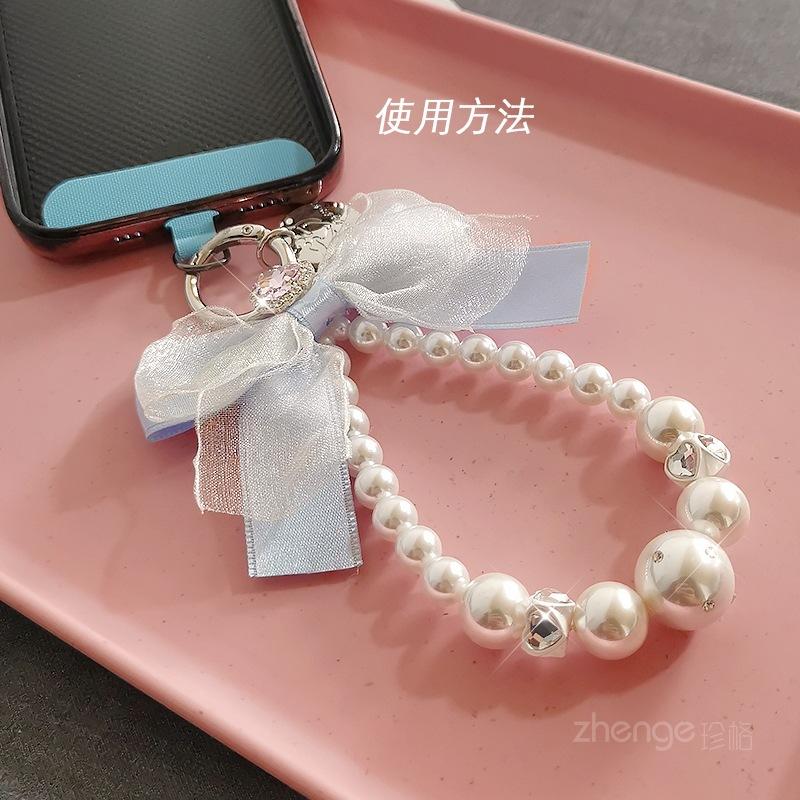 Mesh bow pearl bracelet women's ins fashion Xiaoxiangfeng mobile phone pendant mobile phone lanyard short wrist