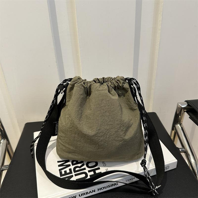 Trendy Large Capacity Women's Casual Shoulder Bag | Solid Color, Drawstring Closure, Polyester Lined, Durable Material, Korean Fashion