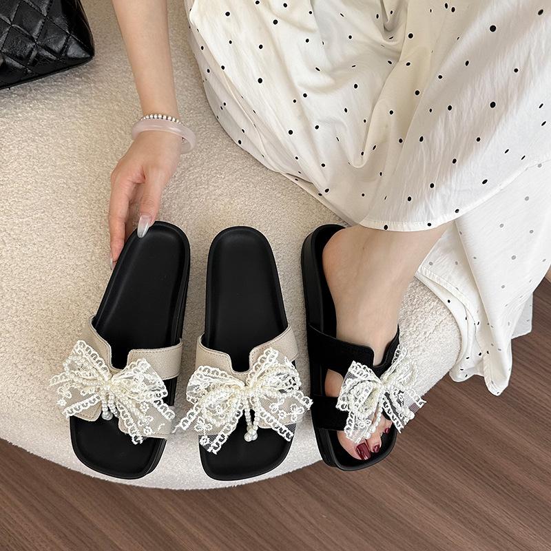 Sweet lace bow one-word female summer flat bottom cool slippers light and comfortable outer wear casual Korean version cool slippers