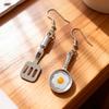 A Pair of Cute Asymmetrical Earrings Shaped Like a Frying Pan And Spatula, Perfect for Daily Wear for a with a Playful Heart