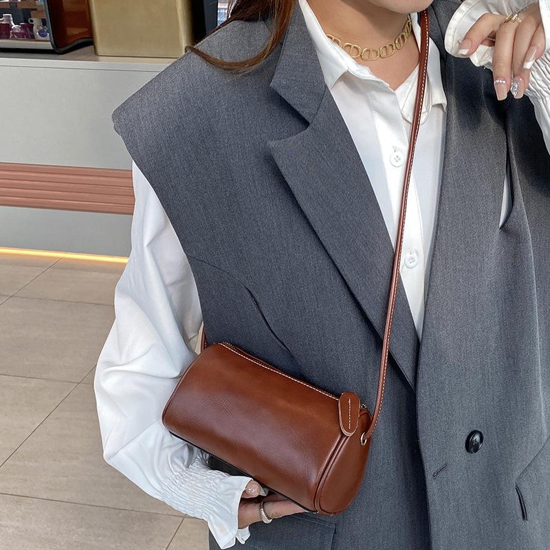 

New Casual Vegetable tanned Cowhide Daily Commuter One Shoulder Cylinder Pillow Bag
