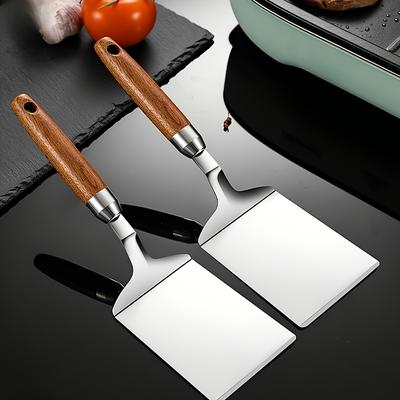Eine Edelstahl-Antihaft-Spatel mit , Rostbeständig, Perfekt für Grillen, Kochen und Backen - ein festliches Küchenaccessoire