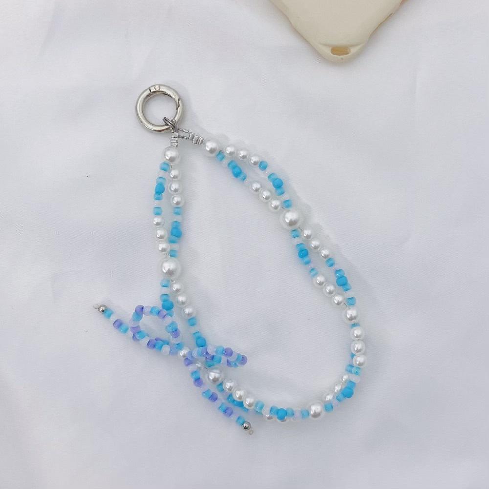

Japan and South Korea, the same Xiaohongshu INS style pearl rice bead bow fashion anti-lost hand carry pendant short mobile phone chain синий