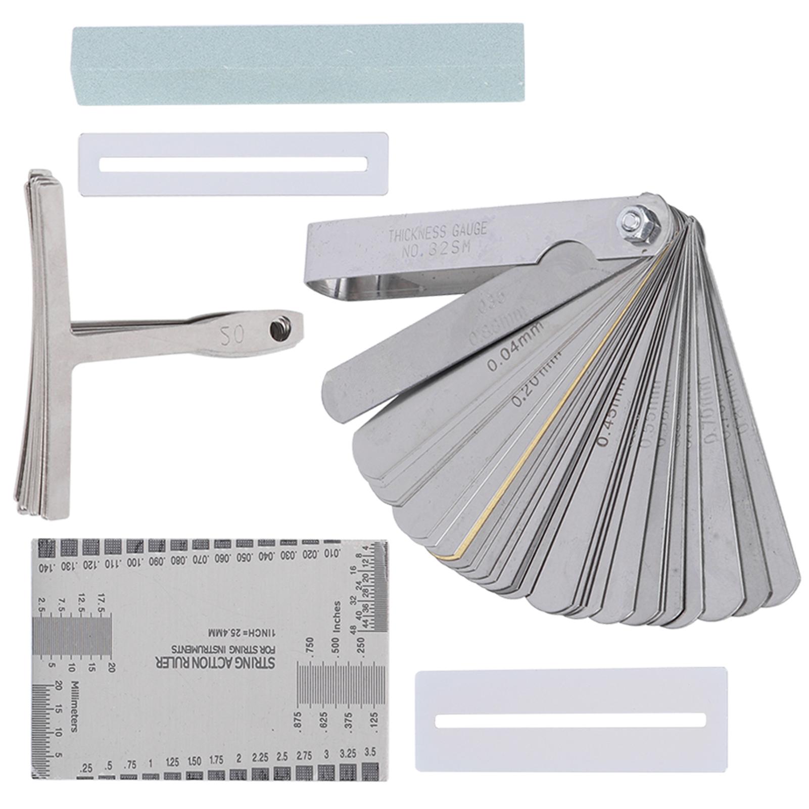 

Набор инструментов для гитары, включая шлифовальный круг, линейку для измерения радиуса струн, защиту накладки грифа