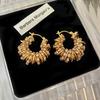 European and American Style Hollow Woven Twist Earrings Emerald Zircon Winding Shape Round Ear Buckle Retro Niche Earrings