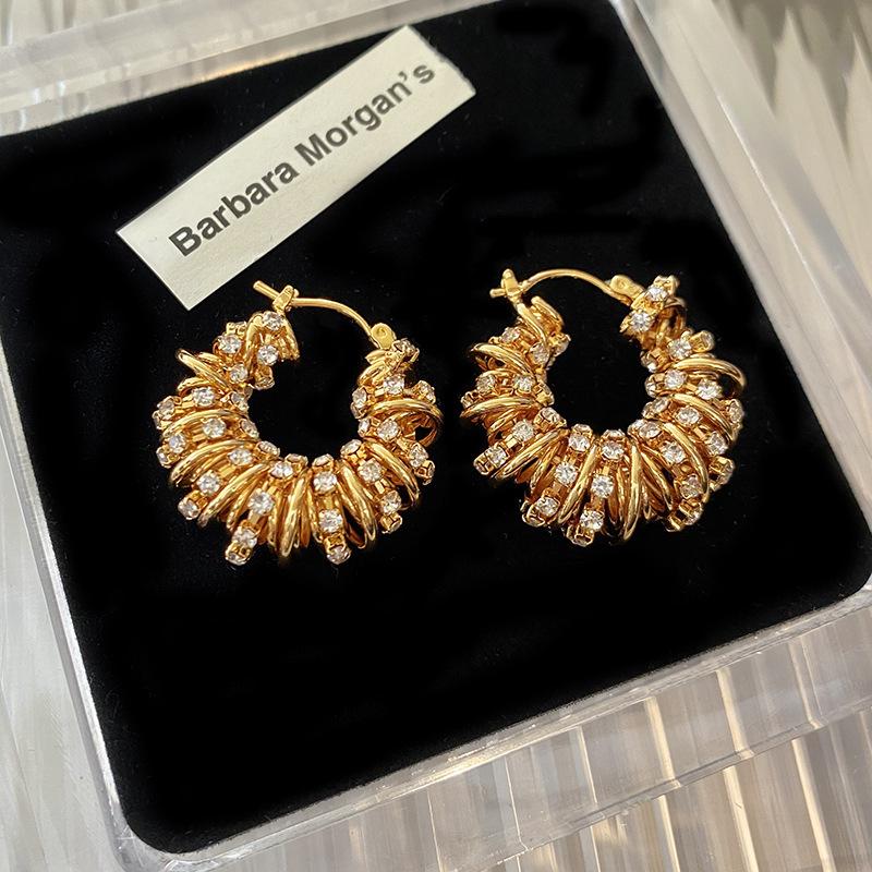 European and American style hollow woven twist earrings emerald zircon winding shape round ear buckle retro niche earrings