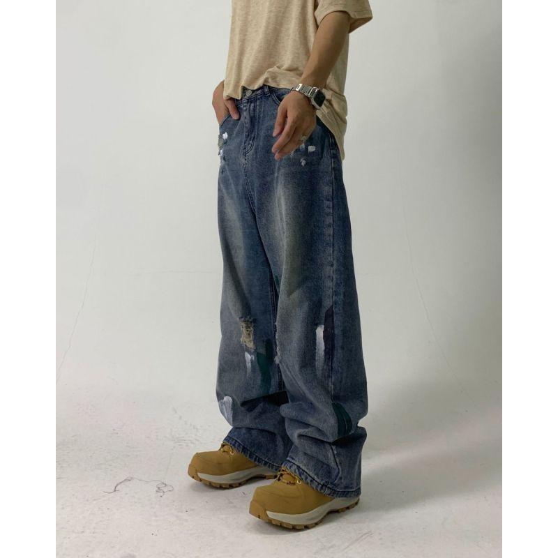 Europejskie i amerykańskie dżinsy uliczne z plamami atramentu dla mężczyzn i kobiet niszowy design z dziurami luźne spodnie z szerokimi nogawkami dla par codzienne spodnie na wszystkie mecze