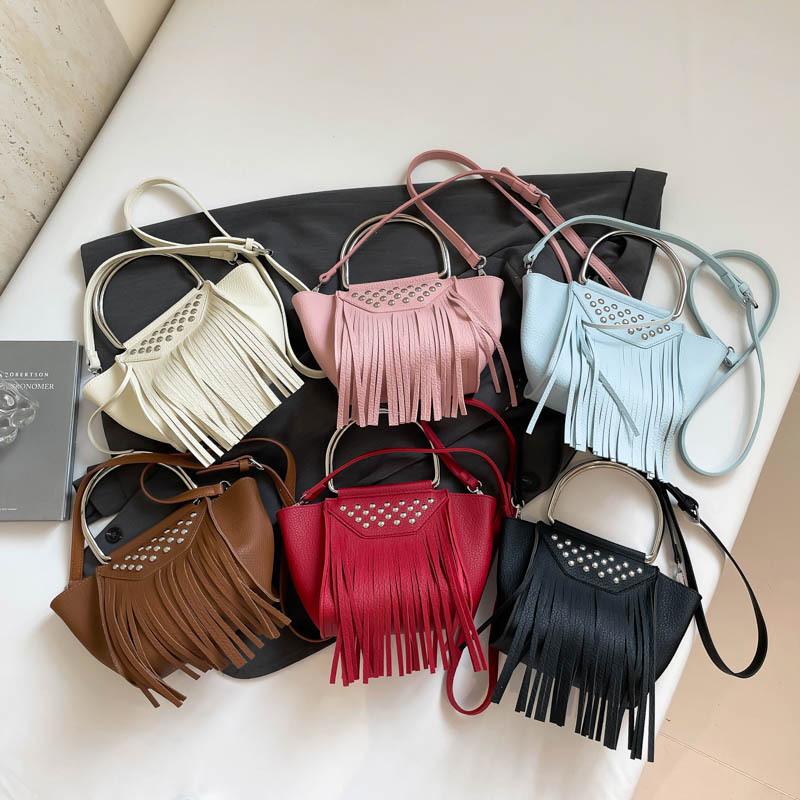 Women's bag spring and summer new 2025 Korean version fashion rivet shoulder bag personalized tassel messenger bucket bag pu