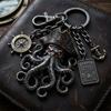 Pendentif Porte-clés avec Boussole Fermoir mousqueton Style Pirate Pendentif en métal Texture Oxydation Vieillie Design Œil Rouge Forme de Poulpe Porte-clés