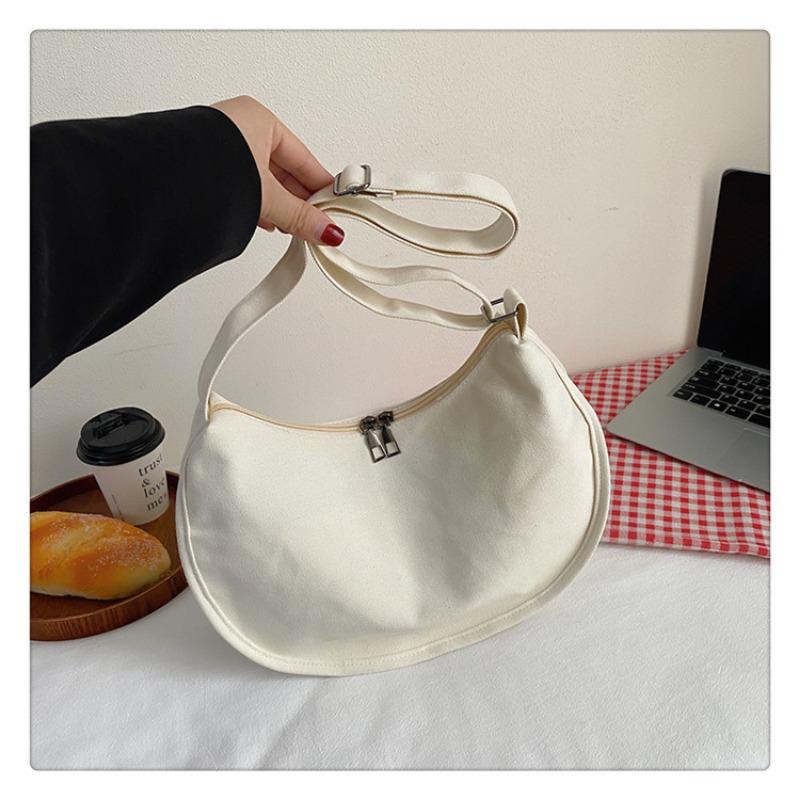 

Large capacity canvas bag women s new casual shoulder dumpling bag student class commuting messenger bag