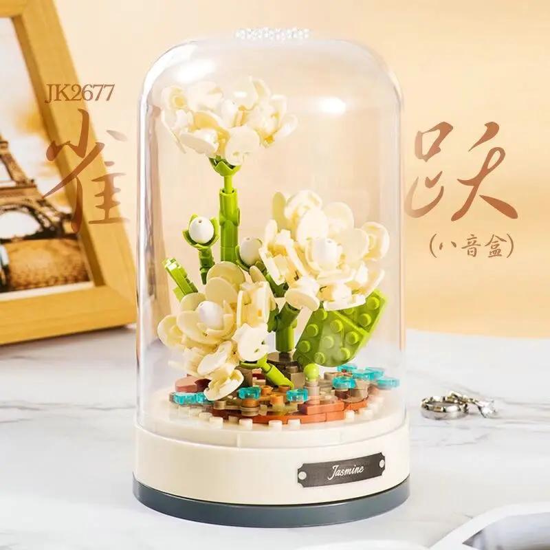 Building blocks music box Clockwork rotating music box Building blocks Rose Lily of the valley puzzle set Valentine's Day gift