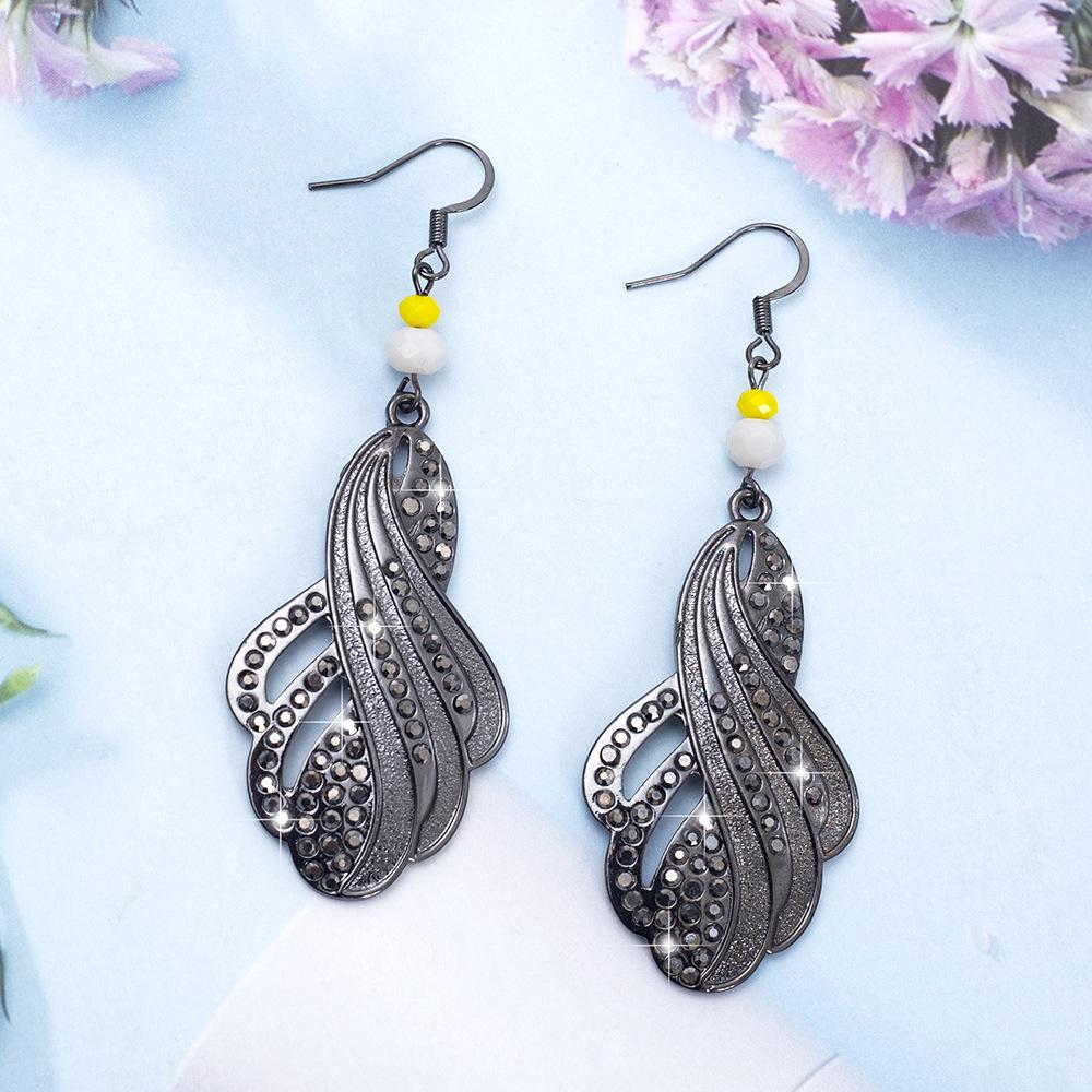 

Vintage Women s Teardrop Earrings with Hollow Twist and Rhinestone Inlay
