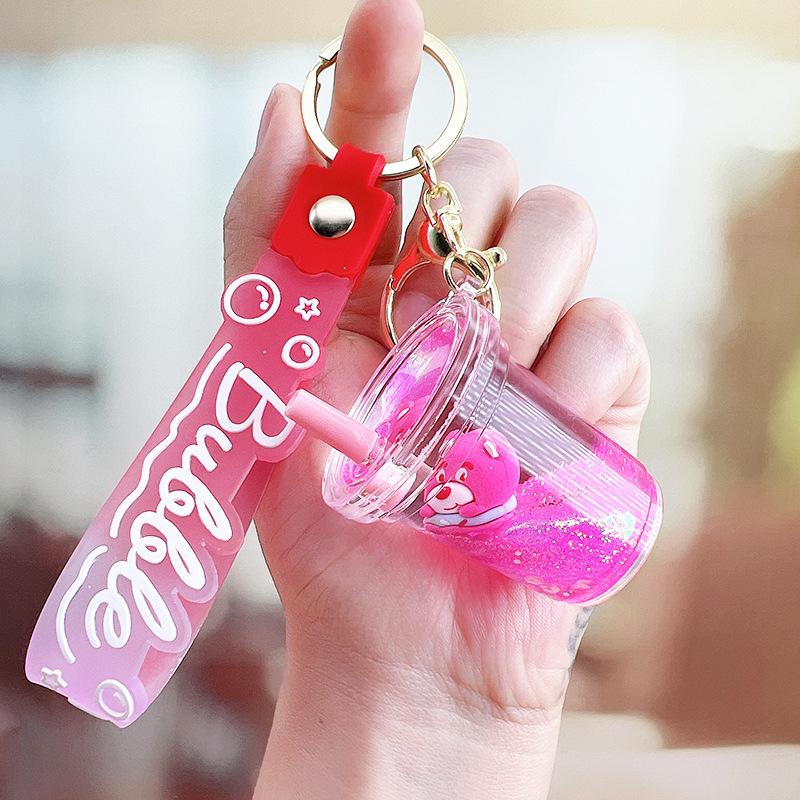 Strawberry Bear Doll Keychain with Colorful Oil-Filled Bottle and Milk Tea Cup Pendant