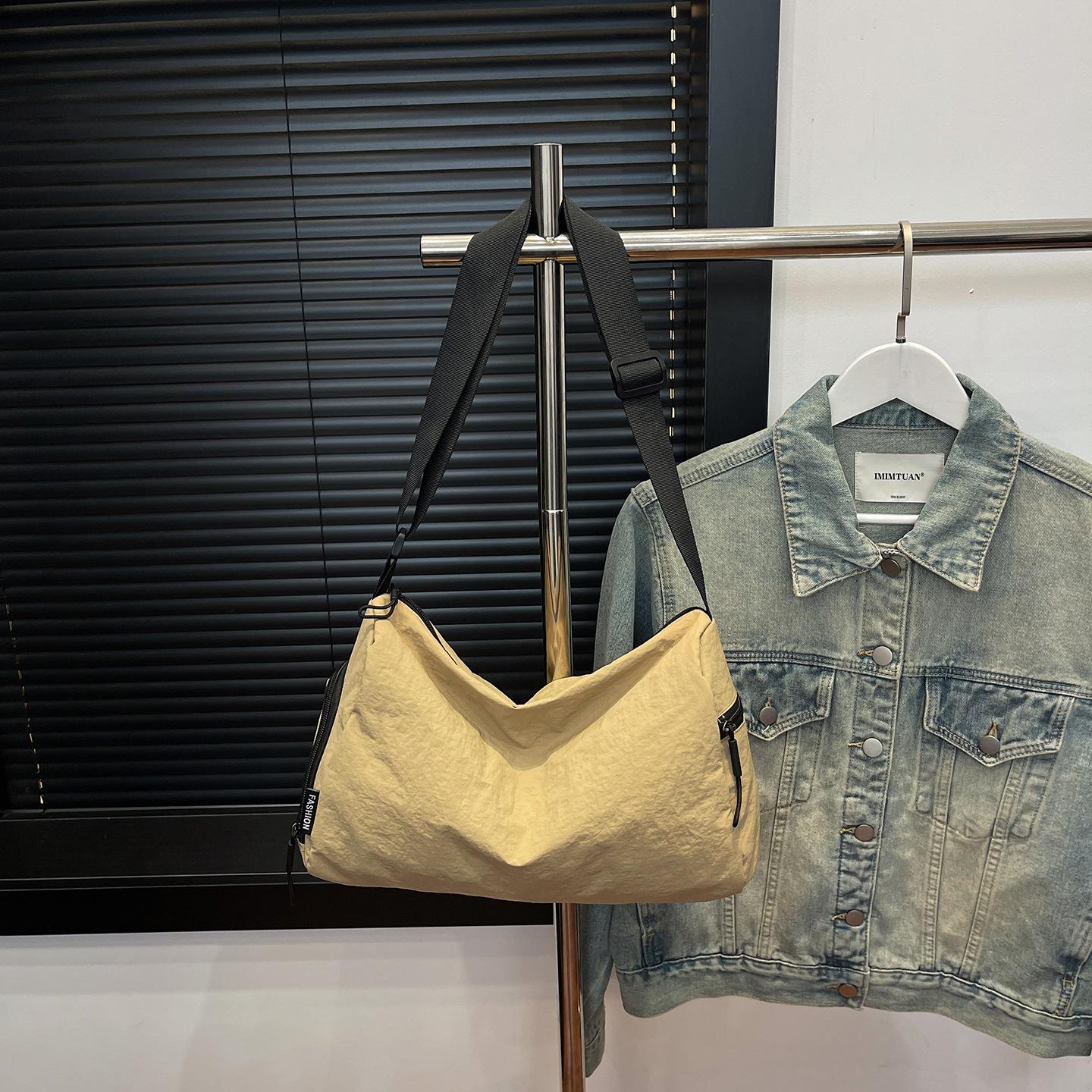 

2025 autumn new fashion simple casual messenger bag large capacity commuter bag Korean niche drawstring shoulder bag хакі