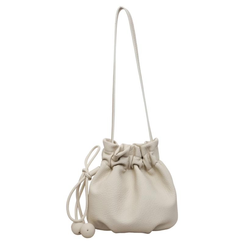 2026 New Drawstring Bucket Bag for Women Soft Leather Crossbody Bag with Ball Charm Mini Shoulder Handbag for Daily Shopping
