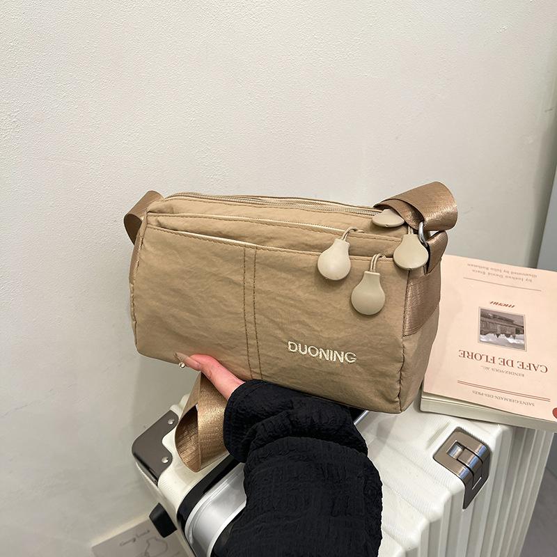 

Multi-compartment large-capacity shoulder messenger bag women s bag outdoor travel anti-splashing ultra-light nylon bag хаки