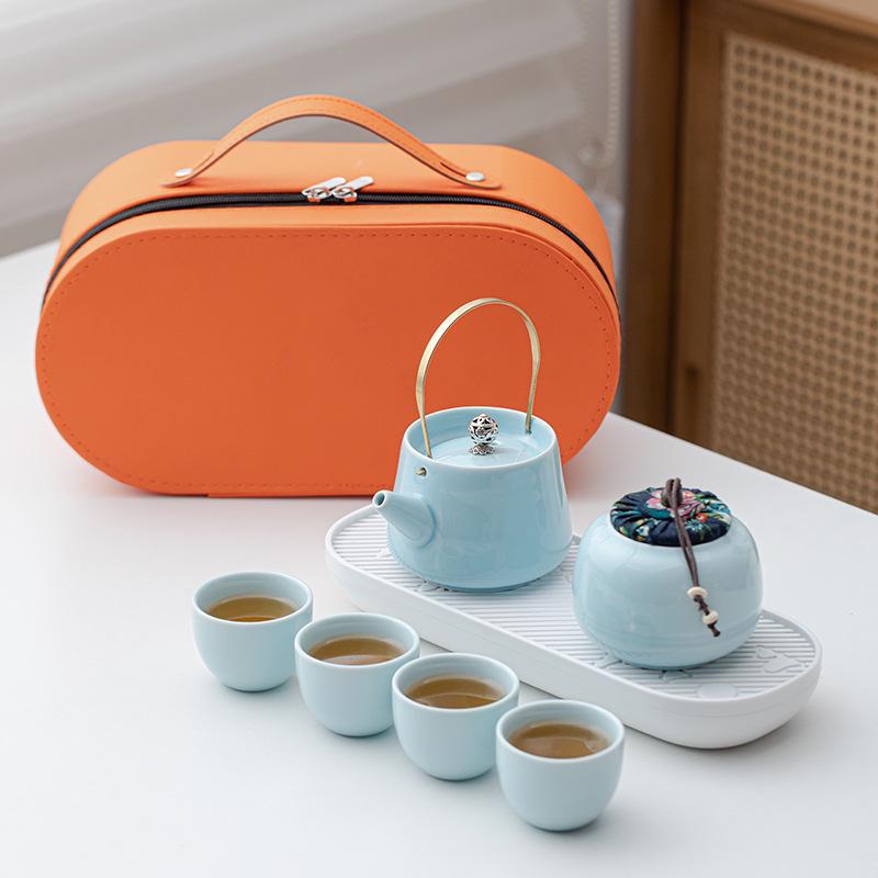 Portable Ceramic Kung Fu Tea Set: Teapot with Handle and Four Cups for Travel and Business Gifting