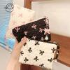 Bolsa pequeña de maquillaje con lazo estampado en rosa y negro para mujer, práctica minicaja para lápiz labial, neceser, bolsa para guardar toallas sanitarias.