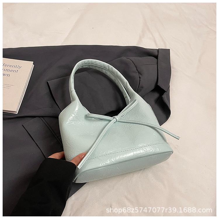 Bow niche portable bucket bag women's 2025 new trendy fashion simple commuter casual shoulder bag
