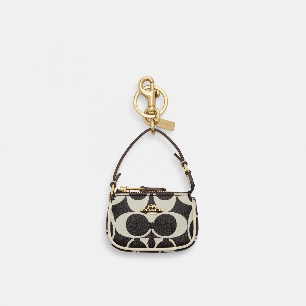 

Сумка-подвеска Coach Mini Nolita из фирменной парусины
