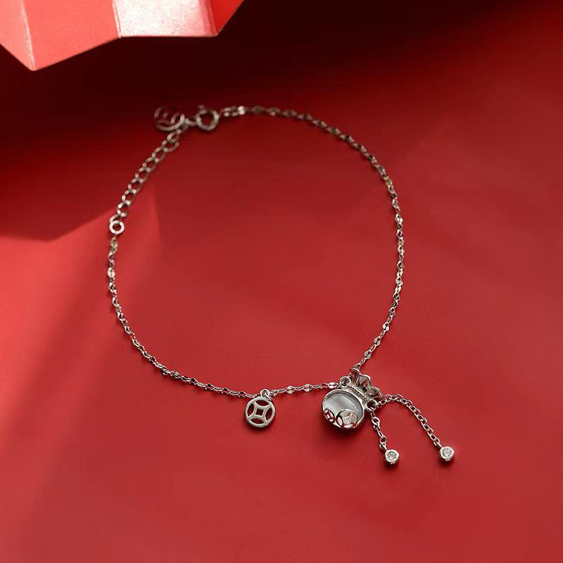 Cat s Eye Stone Fortune Bracelet: Trendy, Elegant, and Lucky Money Bag Design for Women.