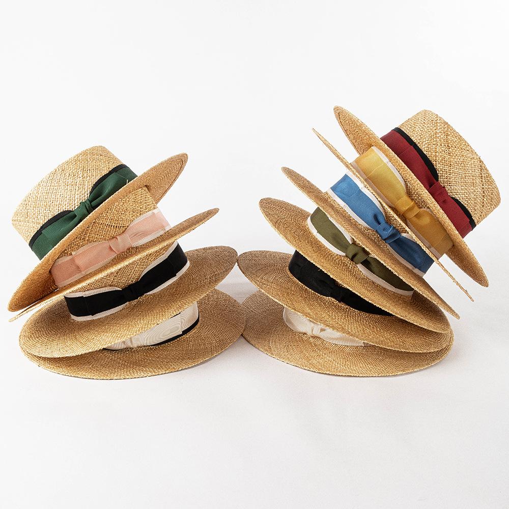 Spring and summer new fashion two-color webbing bow treasure grass wide brim flat top hat outdoor shopping sun protection straw hat