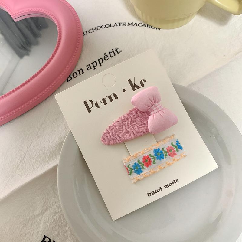 Koreańska spinka do włosów z kokardką w kolorze różowym, idealna do dziecięcych grzywek i kręconych włosów