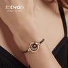 Totwoo Smart Couple Bracelets: Interactive Long-Distance Jewelry with Vibration and Light Sensors.