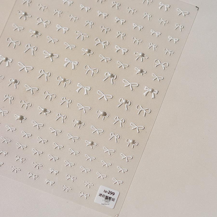 

Tomoni Minimalist Black & White Pearl Bow Nail Decals