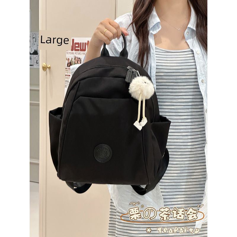 

Japan fashion Ins Simple Casual Backpack Mini Book Bag Women Travel Lightweight College Student Commuting Small Backpack Black large + long leg ball