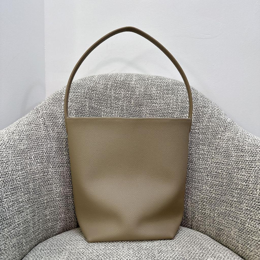 Nova bolsa de balde Row de grande capacidade em couro para mulher estilo minimalista TR com padrão de lichia bolsa tote portátil de ombro para o dia a dia