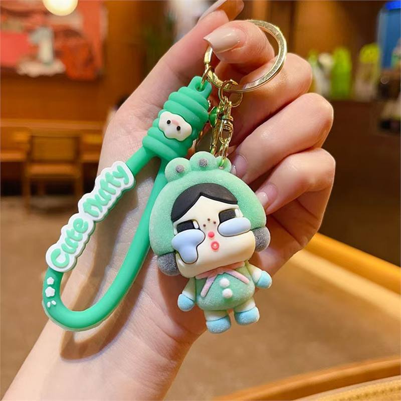 

Креативный флокированный брелок в виде плачущего ребенка, плачущая девочка, милая мультяшная кукла, подвеска для сумки, маленький подарок 1PCS зелёный