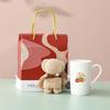 Presentset med keramikmugg och handduk