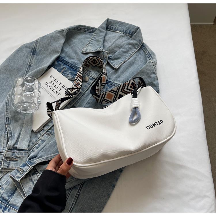 

Canvas bag women s 2025 new spring and summer versatile dumpling bag leisure sports broadband shoulder messenger bag women s bag