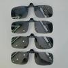 A pair of stylish four-piece flip-on polarized night vision sunglasses with an anti-glare mirror coating, ideal for driving.