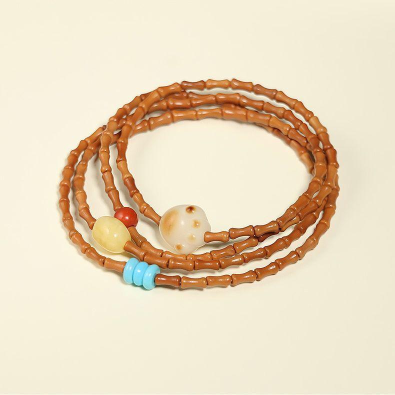 

Olive stone bamboo knot multi-loop bracelet necklace Paired with Bodhi amber accessories, it s a vintage artistic style necklace