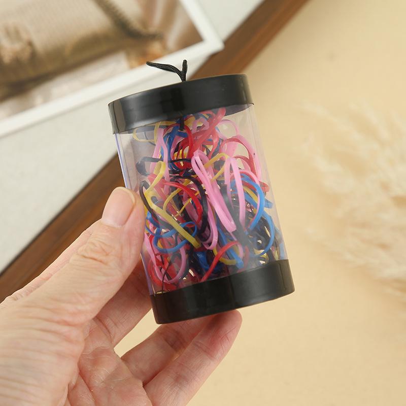 Compact Kids  Hair Ties: Durable, High-Elasticity Rubber Bands in Bright Colors for Versatile and Hair-Friendly Styling.