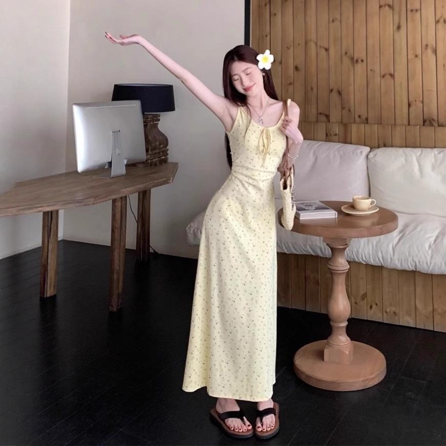 Yellow suspender dress women's summer new French waist design seaside vacation floral long skirt