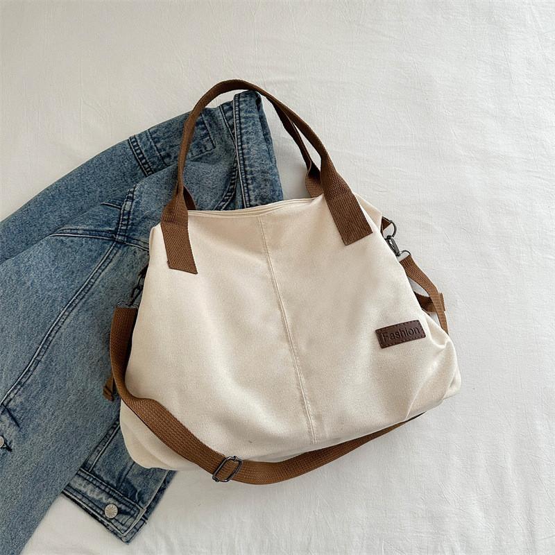 

Chic Large Capacity Crossbody Bag For Women Featuring Soft Canvas And Street Style Appeal білий