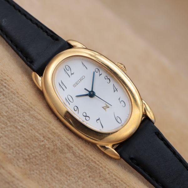 SEIKO NOIE 1F21-5870 SEIKO NOIE Oval Gold Arabia White Ladies Watch 21mm Made in 2001 Battery Replaced CH348
