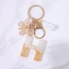 Chic White Tassel Letter Keychain with Resin Epoxy Pendant - Stylish Ornament for Bags