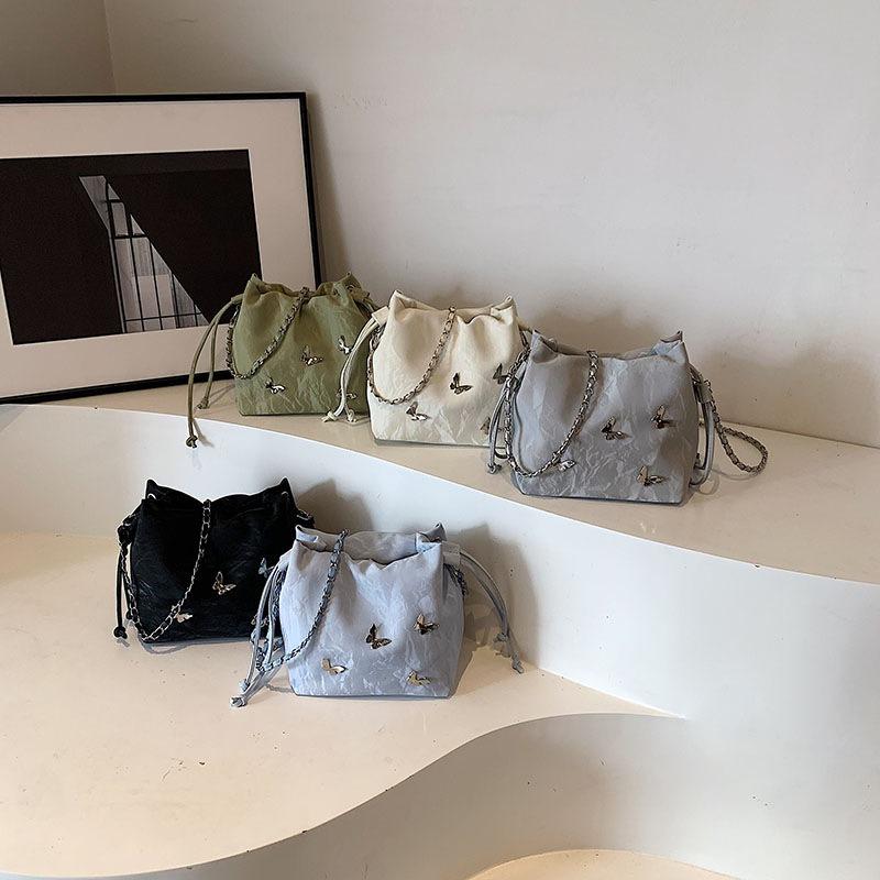 Fashion casual chain messenger bag summer simple pumping strap personalized butterfly shoulder bag new bucket women's bag