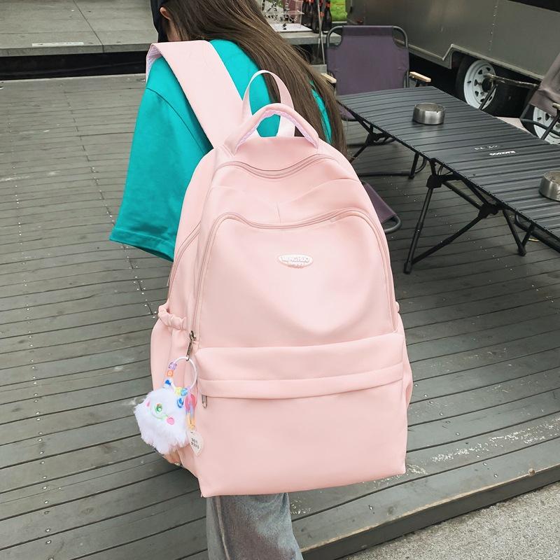 Сладкий ветер, маленький и свежий литературный холст, школьная сумка для студентов, японский и корейский повседневный рюкзак большой вместимости. with pendant розовый