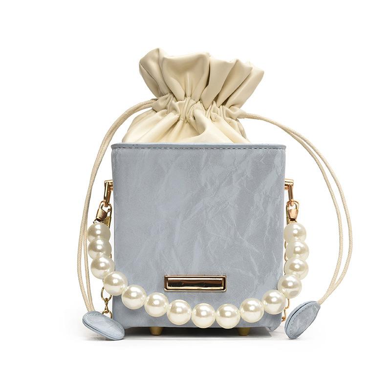Summer Solid Color 2025 New Personalized Pumping Belt Foreign Leisure Sense Simple Pearl Crossbody Portable Bucket Women's Bag Small
