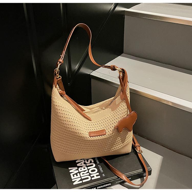 

2025 new vacation beach woven bag female senmeng hollow knitted handbag large capacity shoulder armpit bag хаки