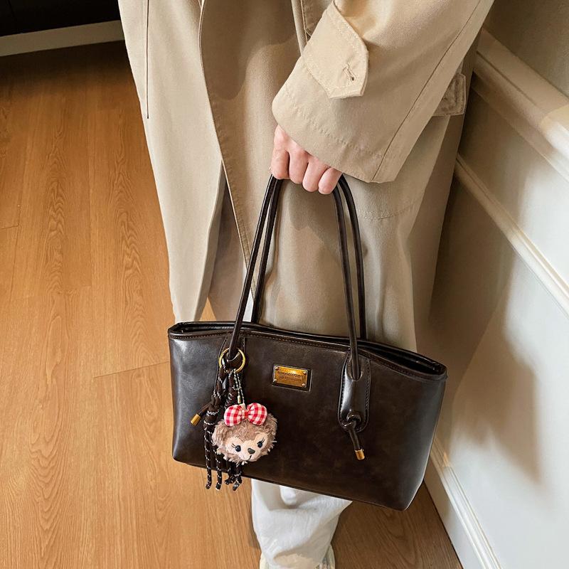Herbst und Winter neue High-End-Textur Retro Nischen-Tasche Damen College-Studentin Pendeln Schulter-Tragetasche