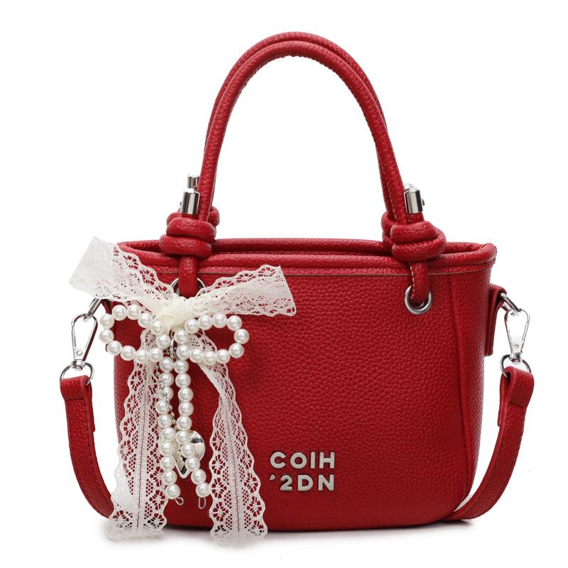 This year, the popular lychee pattern is simple and high-end, portable bucket bag, women's commuting versatile casual style messenger bag