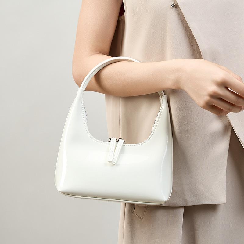 Nouveau design de niche mini sac à main en cuir haut de gamme luxe léger cuir de vache argenté épaule aisselle femme