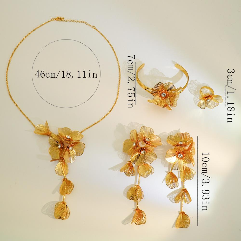 Exquisite 4-Piece Tassel Jewelry Set: Hollow Flower Necklace, Earrings, Bracelet & Ring