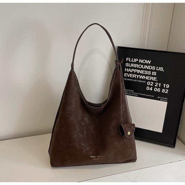 

Autumn new large-capacity tote bag 2025 women s commuting temperament Korean version ins premium texture shoulder bag темно-коричневого кольору